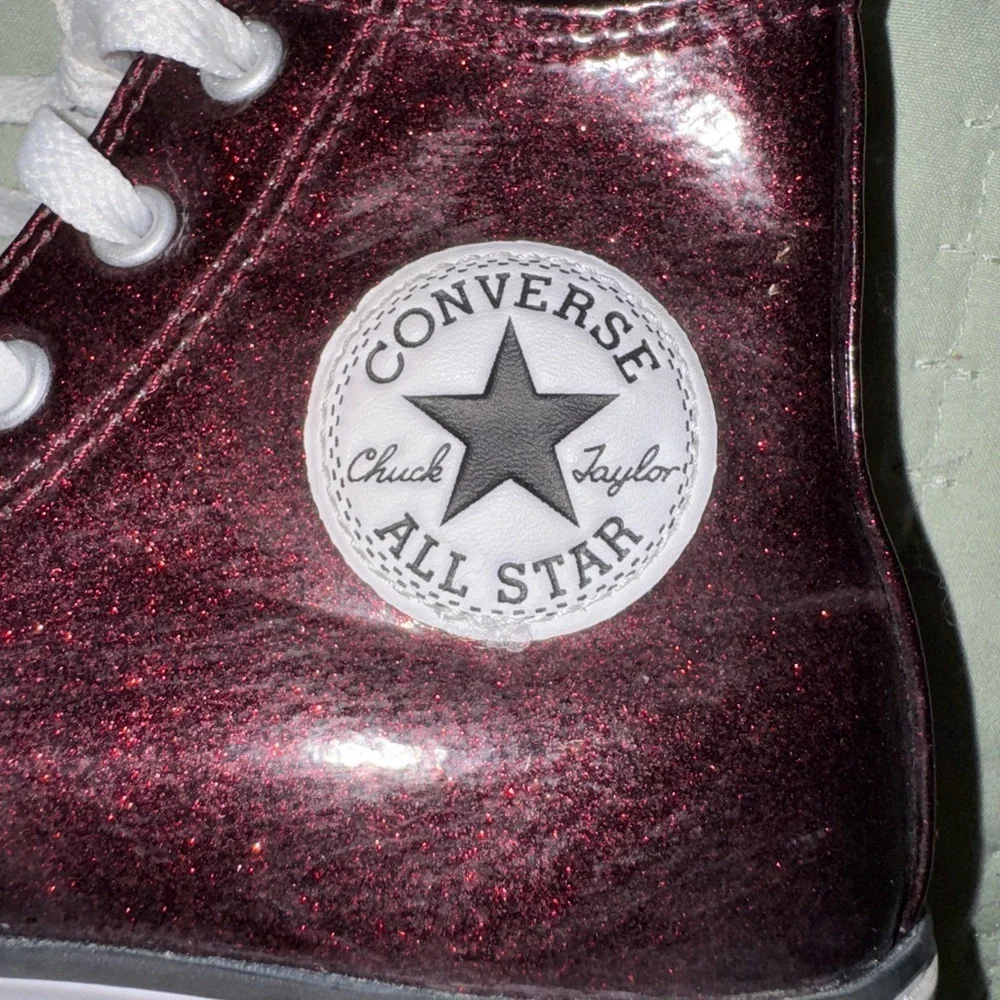 Shimmer black cherry high top Chuck Taylor converse big kids size 3. GUC